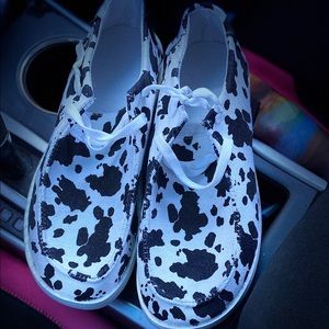 Cow print slip on shoes